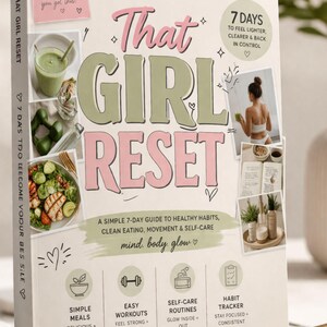 May include: A book titled "That Girl Reset" with a pink and green design. The cover features the title, images of healthy food, and text promoting a 7-day guide to healthy habits, clean eating, movement, and self-care. The book is on a white background.