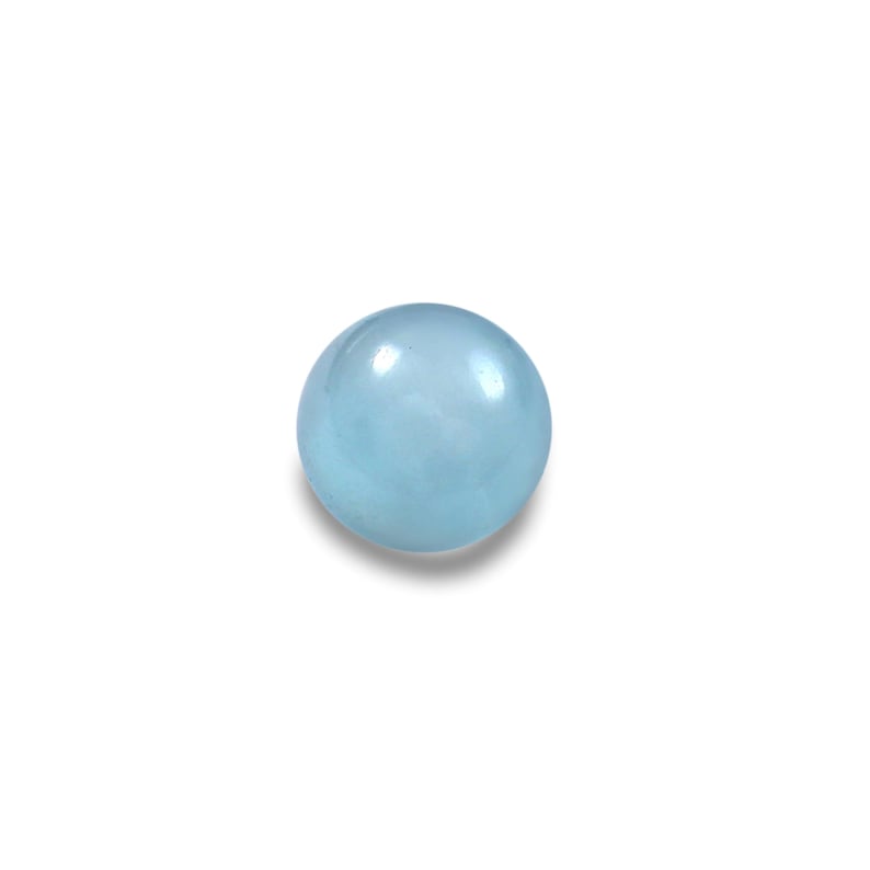 May include: A round, light blue gemstone with a smooth, polished surface. The gemstone is a pale, translucent color, and it is set against a white background. The gemstone is likely a cabochon, a gemstone that has been shaped and polished rather than faceted.