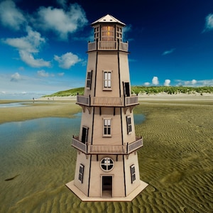 May include: A wooden model lighthouse with a light on top, standing on a sandy beach with a blue sky and white clouds in the background.