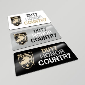May include: Three rectangular stickers with the words "Duty Honor Country" in a distressed font. The stickers are in black, silver, and white with a gold Spartan helmet logo.