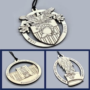 May include: Three wooden ornaments featuring West Point designs. One ornament displays the West Point crest with the words "Country, Honor, Duty." Another shows Washington Hall, and the third features a hat and wings.