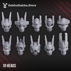 May include: Ten gray plastic robot heads in various designs, each with unique features like antennae and visors. The heads are arranged in two rows on a dark background. The text "10 HEADS" is at the bottom, and "DakkaDakka.Store" is at the top.