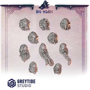 May include: A collection of gray miniature heads and helmets, including bearded faces and futuristic helmet designs. The text "BIG HEADS" is displayed at the top, and "GREYTIDE STUDIO" is at the bottom.