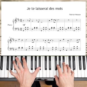 May include: A piano keyboard with black and white keys, with sheet music on top. The sheet music has the title "Je te laisserai des mots" and the composer's name, Patrick Watson. Hands are playing the piano.