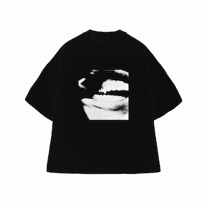 May include: Black t-shirt with a monochrome image of a mouth and teeth. The graphic is printed on the front. The shirt has short sleeves and a round neck.
