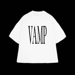 May include: White t-shirt with the word "VAMP" printed in large, black, bold letters. The shirt has short sleeves and a crew neck. The background is solid black.