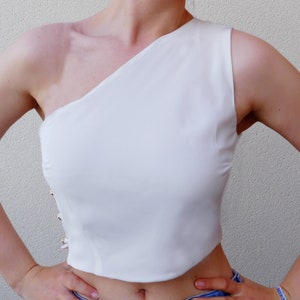 PDF sewing pattern for a one-shoulder crop-top, off-the-shoulder top with side button closure.