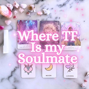 May include: Six rectangular tarot cards arranged in two rows on a white marble surface. The top row features cards with ethereal imagery, while the bottom row displays simple icons of a heart with swords, a crescent moon, and hearts. Pink sparkles and text reading Where TF Is my Soulmate are overlaid.