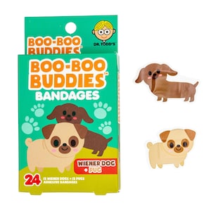May include: A box of 24 assorted adhesive bandages featuring cartoon Wiener Dog and Pug designs. The box is green and features the text "Boo-Boo Buddies Bandages" and "Wiener Dog + Pug".