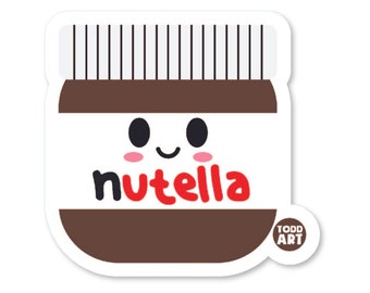 May include: A sticker of a brown jar with a white lid and a smiling face. The jar has the word "Nutella" printed on it in red letters. The sticker has a small white circle with the text "TODD ART" in black letters.