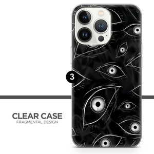 K&ouml;nnte beinhalten: Eine transparente Handyh&uuml;lle mit einem schwarz-wei&szlig;en Design aus vielen Augen. Die H&uuml;lle ist f&uuml;r ein iPhone 13 Pro Max konzipiert.