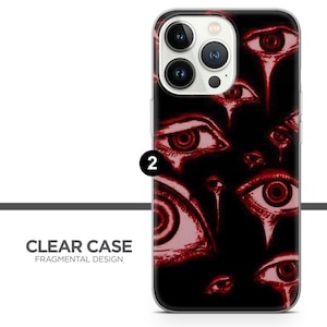 K&ouml;nnte beinhalten: Eine transparente Handyh&uuml;lle mit einem Design aus roten Augen auf schwarzem Hintergrund. Die H&uuml;lle ist kompatibel mit dem iPhone 13 Pro Max.
