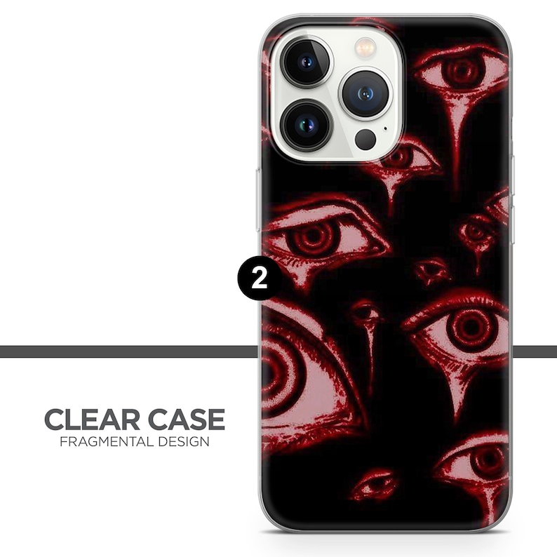 K&ouml;nnte beinhalten: Eine transparente Handyh&uuml;lle mit einem Design aus roten Augen auf schwarzem Hintergrund. Die H&uuml;lle ist kompatibel mit dem iPhone 13 Pro Max.