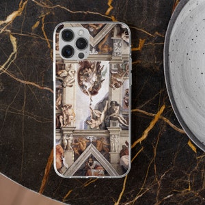 May include: A clear phone case with a colorful image of the Sistine Chapel ceiling. The image features a scene of God reaching down to touch the hand of Adam. The case is designed for an iPhone.