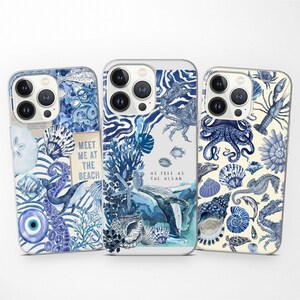 May include: Three phone cases with different ocean-themed designs. The first case features a blue and white design with the text "Meet me at the beach". The second case features a blue and white design with the text "As free as the ocean". The third case features a blue and white design with a variety of sea creatures.