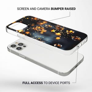 May include: A clear phone case with a raised camera bumper and a design of gold stars and lights on a dark blue background. The case is shown on a white phone.
