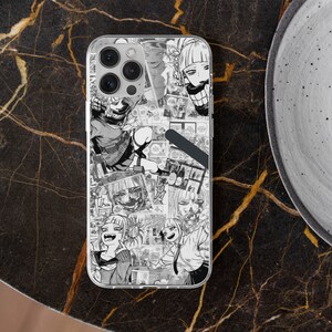 May include: A clear phone case with a black and white manga-style design featuring multiple characters with different expressions. The case has a cutout for the camera lens.
