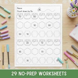 May include: A white worksheet with the title "Count down by 5s" and honey pot illustrations. The worksheet includes numbers and blank spaces for completing math problems. The bottom of the page reads "29 NO-PREP WORKSHEETS".