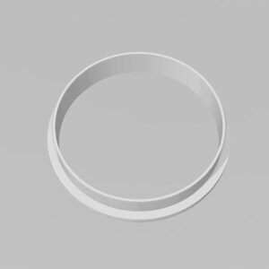 May include: White plastic round cookie cutter.