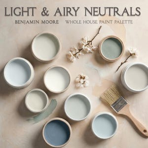 May include: A collection of paint samples in small, round containers, showcasing a palette of light and airy neutral colors. The image includes a paintbrush and sprigs of white flowers, with the text "LIGHT & AIRY NEUTRALS" and "BENJAMIN MOORE WHOLE HOUSE PAINT PALETTE".