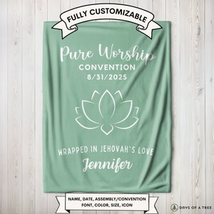May include: A green fleece blanket with white text that reads "FULLY CUSTOMIZABLE", "Pure Worship", "CONVENTION", "8/31/2025", "WRAPPED IN JEHOVAH'S LOVE", and "Jennifer". A white lotus flower icon is centered on the blanket. The text at the bottom reads "NAME, DATE, ASSEMBLY/CONVENTION FONT, COLOR, SIZE, ICON".