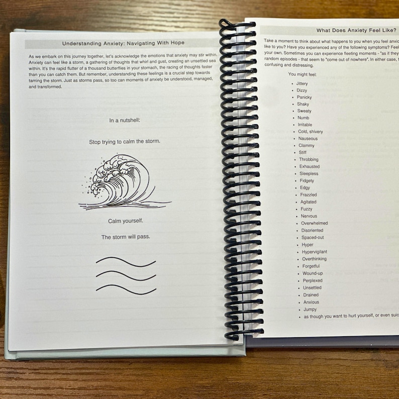 May include: A page from a self-help journal with the title "Understanding Anxiety: Navigating With Hope". The page features a simple illustration of a wave and the text "Stop trying to calm the storm. Calm yourself. The storm will pass."
