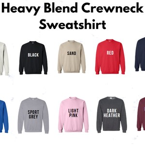 May include: A range of crewneck sweatshirts in a variety of colours, including white, black, sand, red, navy, royal blue, sport grey, light pink, dark heather, and maroon. The sweatshirts are all made from a heavy blend fabric.
