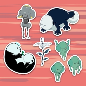 May include: A set of eight stickers featuring various cartoon characters and a flower. The stickers are white with black outlines and feature a robot, a white creature with a black tail, a green creature with a black star, a white flower with a black stem, and three green creatures with black stars.