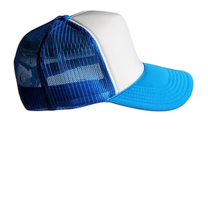 May include: A trucker hat with a white front panel, a blue brim, and a blue mesh back. The hat has a curved brim and a snap closure. This hat is a stylish accessory for casual wear.