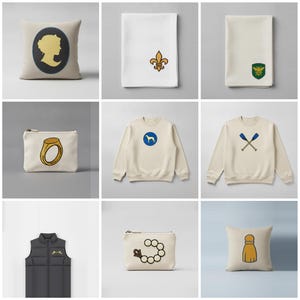 May include: A collection of items including a beige pillow with a cameo silhouette, a white napkin with a gold fleur-de-lis, a white napkin with a bee crest, a beige pouch with a gold ring, two beige sweatshirts with dog and oar graphics, a black vest, a beige pouch with a pearl bracelet, and a beige pillow with a tassel.