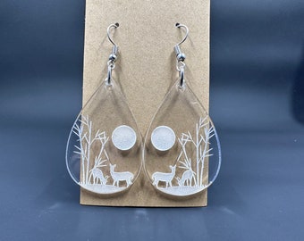 Deer scene earrings made from a few different materials.