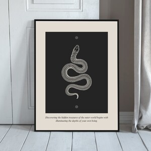 May include: A black and white illustration of a snake with the text "Discovering the hidden treasures of the outer world begins with illuminating the depths of your own being."