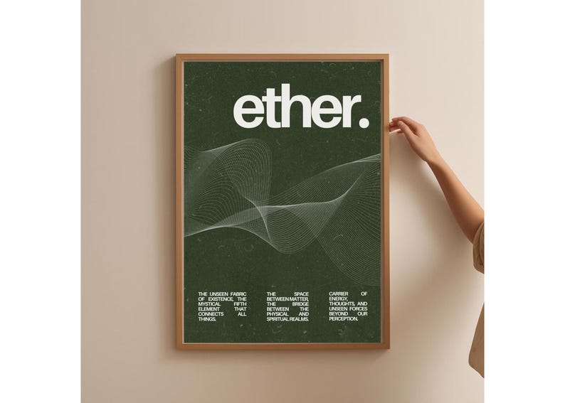 May include: A framed art print with the word "ether" in white, over a dark green background. The print features a white, wavy line design and text describing the unseen fabric of existence. The frame is a light brown color.