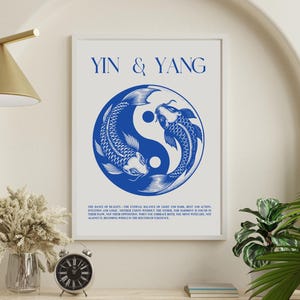 May include: A white poster with the text "Yin & Yang" in blue lettering. The poster features a blue yin yang symbol with two fish swimming around it. The text below the symbol reads: "The dance of duality. The eternal balance of light and dark, rest and action, intuition and logic. Neither exists without the other. For harmony, you must find in their flow, not their opposition. When the contrast between the two worlds in life, is grasped it becomes whole in the rhythm of existence."