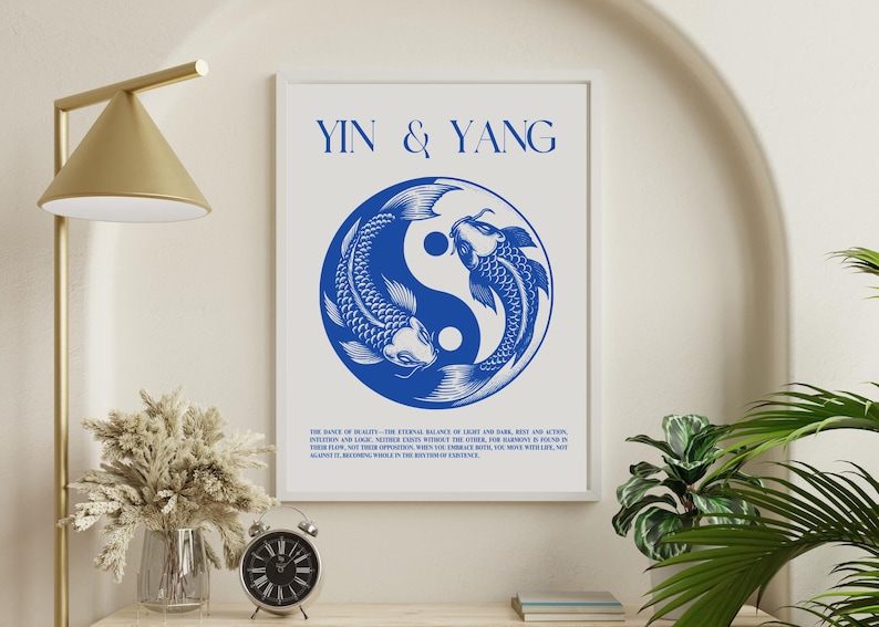 May include: A white poster with the text "Yin & Yang" in blue lettering. The poster features a blue yin yang symbol with two fish swimming around it. The text below the symbol reads: "The dance of duality. The eternal balance of light and dark, rest and action, intuition and logic. Neither exists without the other. For harmony, you must find in their flow, not their opposition. When the contrast between the two worlds in life, is grasped it becomes whole in the rhythm of existence."