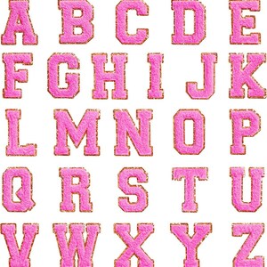May include: Pink felt alphabet letters with gold glitter accents. Each letter is outlined in gold. The letters are arranged in alphabetical order.