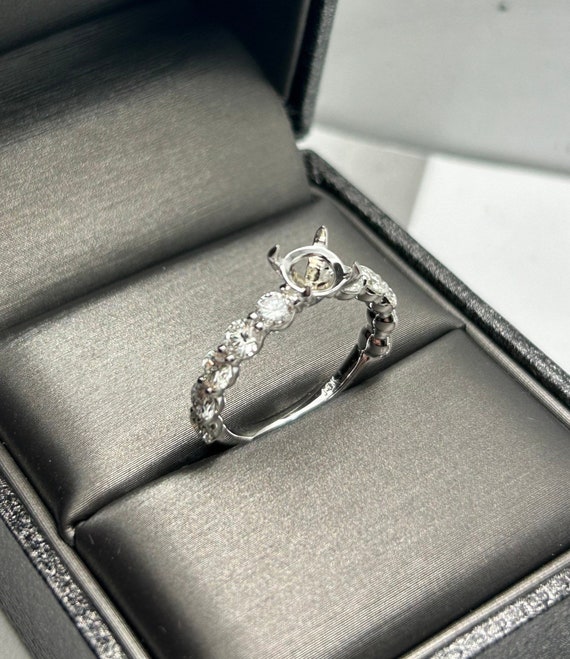 Engagement ring without center clearance stone