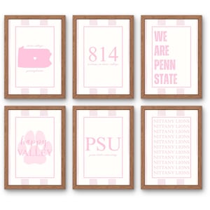 May include: Six framed prints with a pink and white theme. The prints feature text and graphics, including a state outline, the number 814, the words "We Are Penn State," a paw print, and the letters "PSU." The frames are brown.