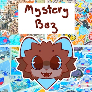 May include: A cartoon illustration of a brown and blue creature with large eyes and a smiling mouth. The image is surrounded by colourful stickers and has the text "Mystery Box" in brown letters.