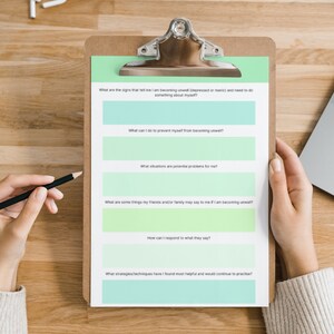 May include: A checklist on a clipboard with the title "What are the signs that tell me I am becoming unwell (depressed or manic) and need to do something about myself?" and several questions about mental health.