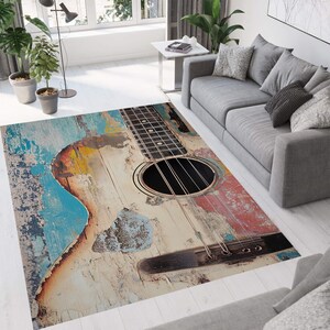 May include: A colorful rug with a distressed wooden acoustic guitar design. The guitar is painted in shades of blue, yellow, red, and brown.