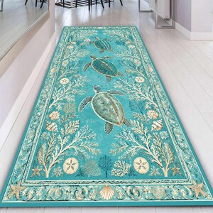 May include: A rectangular runner rug featuring a vibrant turquoise background with a repeating pattern of sea turtles, white coral branches, seashells, and sand dollars. The border is decorated with intricate scrollwork and starfish motifs.