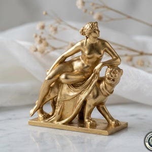 May include: A set of three ceramic mugs with a speckled, matte finish. Each mug features a different color: light blue, cream, and gray. The mugs have a simple, modern design with a rounded shape and a comfortable handle.