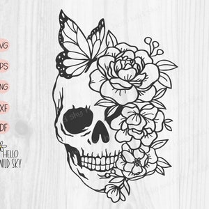 May include: Black and white line art illustration of a skull with flowers and a butterfly. The skull has a floral crown with a butterfly on top. The flowers are detailed and intricate.