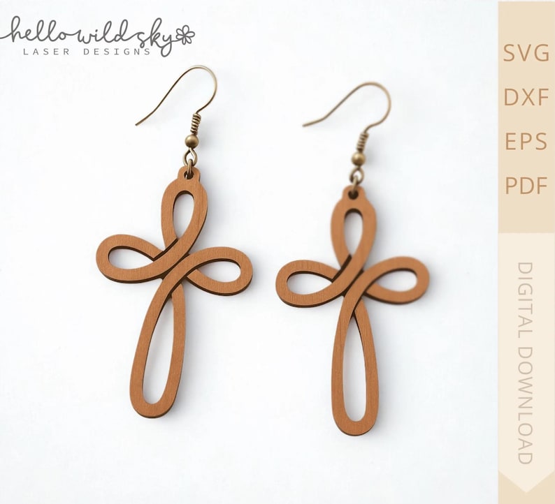 May include: A pair of wooden cross earrings with a light brown finish. The earrings feature a looped design and are suspended from gold-colored ear wires. The image also includes the text "hello wild sky laser designs" and "DIGITAL DOWNLOAD".