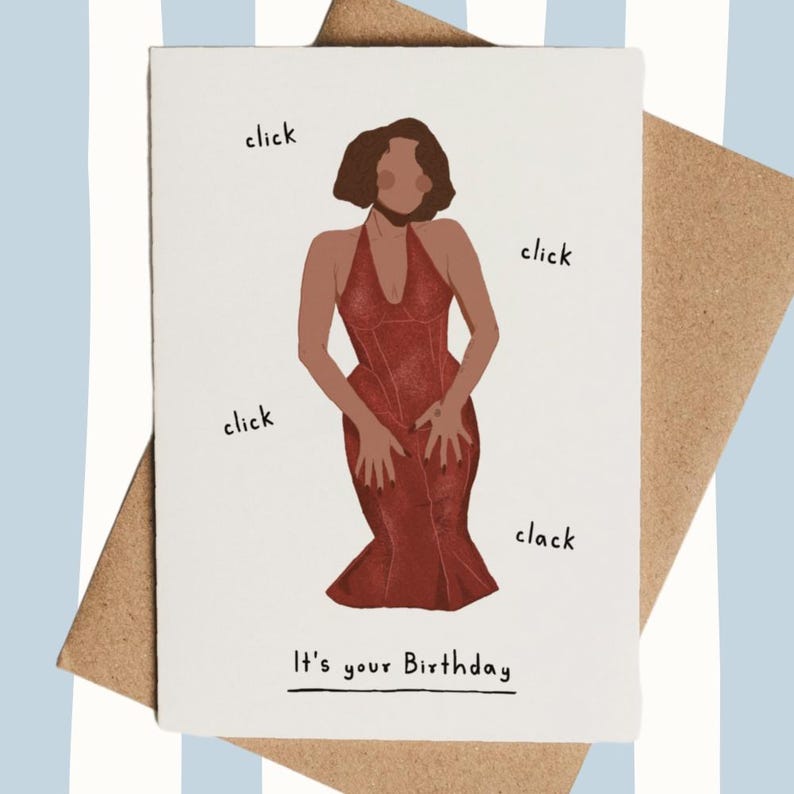 May include: Birthday card with an illustration of a person in a red dress, surrounded by the words "click" and "clack." The text "It's your Birthday" is at the bottom. The card is on a brown envelope, with a blue and white striped background.