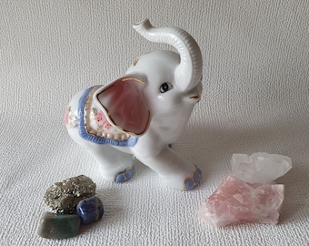 Gracefully decorated hand-painted porcelain elephant, in perfect condition, marked, height 15 cm