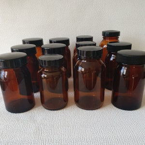 Vintage amber brown glass bottles/jars with black plastic cap