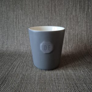 May include: A handmade wooden chopping board with a natural finish. The board has a live edge on one side and a smooth, rectangular shape. It's approximately 45 cm long and 30 cm wide.