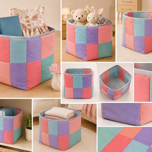 May include: A square storage bin featuring a patchwork design of rectangular fabric panels in pastel shades of pink, purple, blue, and teal. The bin has a light gray fabric trim along the top edge and a solid light gray interior lining.